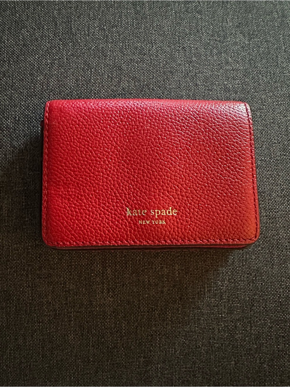 kate spade red pebbled leather small wallet with gold logo